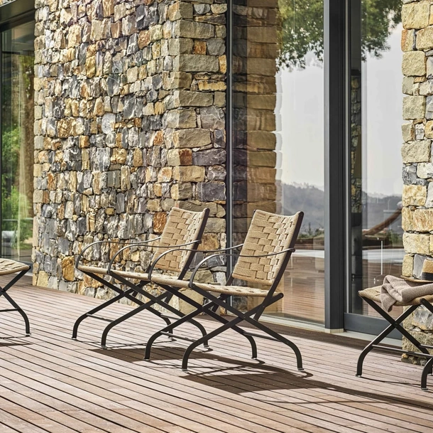 Carlotta Outdoor woven rope and steel armchair by Flexform